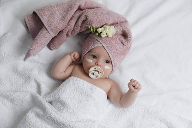 istock Cute little baby with cream on face, top view 1455240535