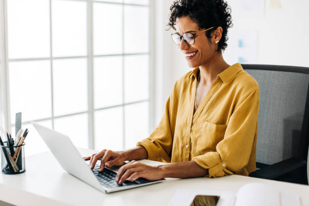 istock Business woman typing on a laptop 1455241204