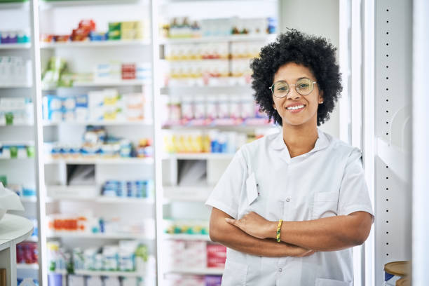 istock Confident pharmacist with arms crossed in pharmacy 1455244361