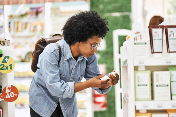 istock African woman checking a product in pharmacy 1455245557