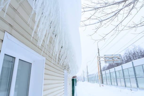 istock Close-up of icicles on the roof. 1455245718