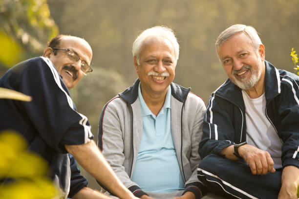 istock Old male friends spending leisure time at park 1455245974