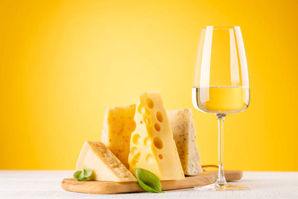 various cheese on board and white wine - cheese emmental cheese swiss culture cutting board imagens e fotografias de stock