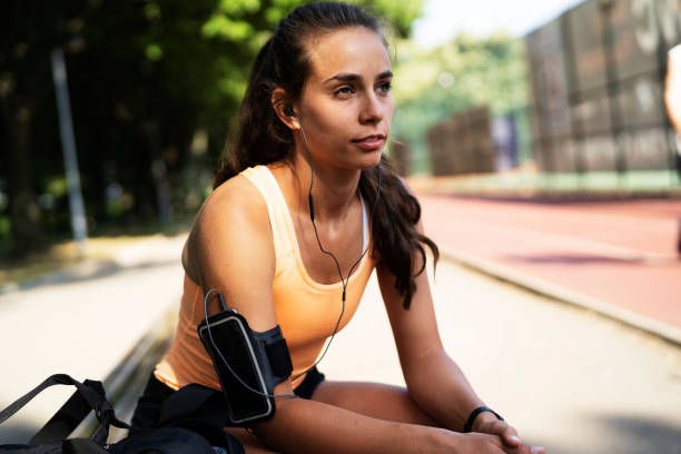 istock Woman in sportswear resting after training. 1455247115