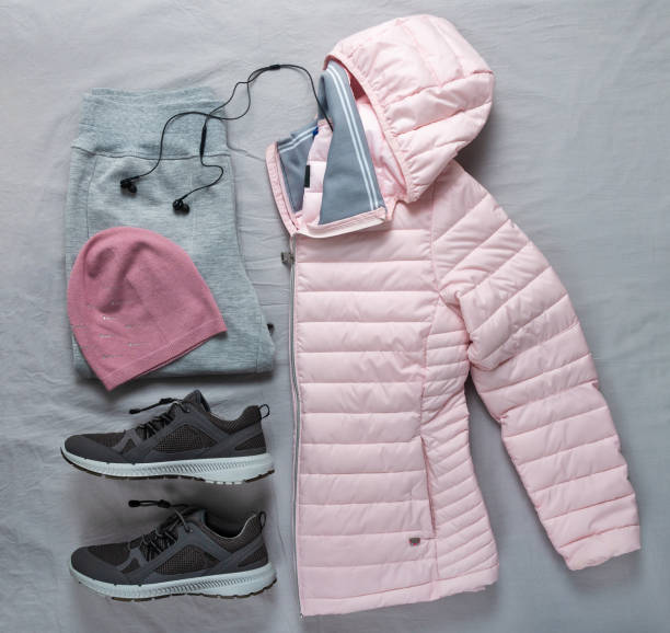 istock A set of outer sportswear - a pink jacket, trousers and sneakers. 1455247708