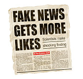 Tabloid newspaper headline screams about fake news getting more likes on social media