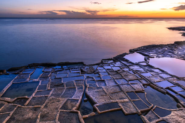 istock Marsaskala salt pans and se at sunrise, Malta 1455248567