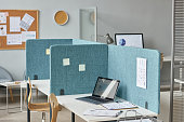 Office interior with workplaces separated by partition walls