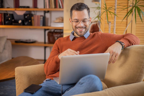 istock Young fashionable man working at home 1455250265