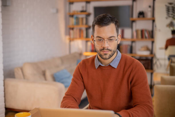 istock Young fashionable man working at home 1455250268