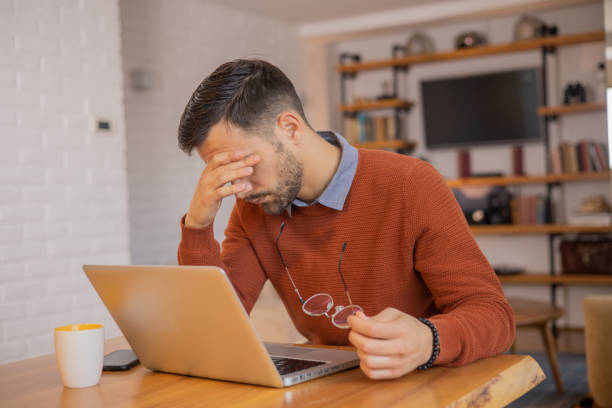 istock Young fashionable man working at home 1455250345