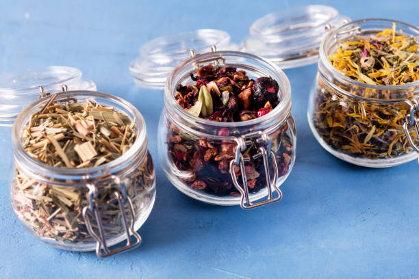 istock Three Jars of Different Leaf Teas on Blue Background Horizontal Above 1455250639