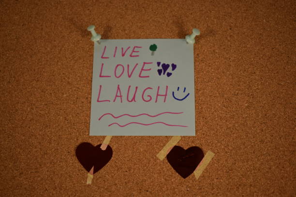 istock Live, Love, Laugh message on a paper on a pinboard 1455252232