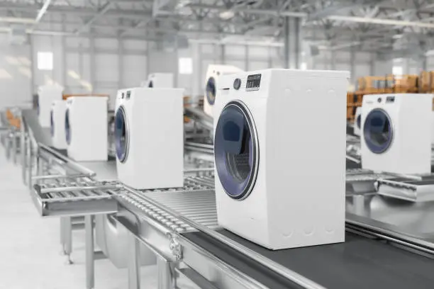 Photo of Close-up View Of Washing Machines On Conveyor Belt In Warehouse