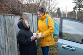 The woman brought food and drinks to a lonely grandmother in the village.