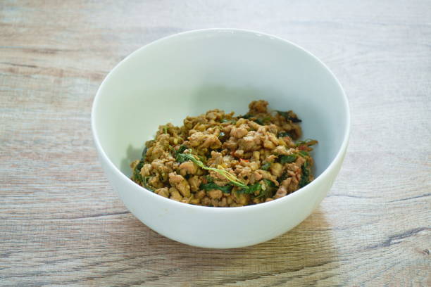 istock spicy stir fried chop pork with chili and basil leaf 1455252431