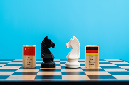 Chessboard with Chinese and German flags.(The four national characters on each wooden block are Korean, Chinese characters, English and Russian)
