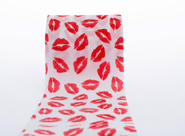 Toilet paper with lipstick kiss pattern.