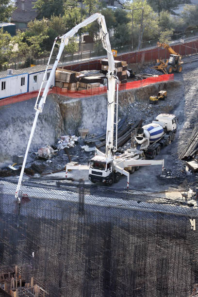 istock Construction site with concrete mixer truck and crane 1455262125