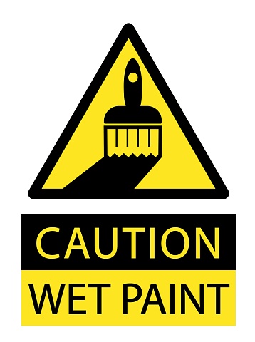 Caution, wet paint. Yellow triangle sign with silhouette of paintbrush . Text below.