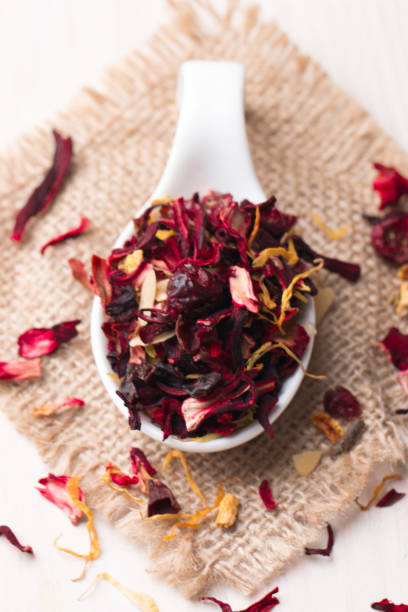 istock Dry red floral fruit and herbal hibiscus tea with petals 1455264595