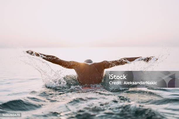 Determined Athletes Swim Training Stock Photo - Download Image Now - Swimming, Athlete, Sea