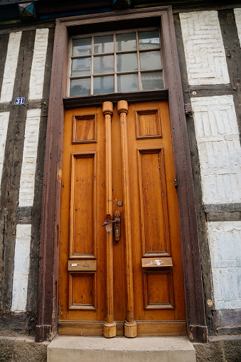 Quedlinburg, Saxony-Anhalt, Germany, 28 October 2022: Wooden vintage door, antique house in medieval town, Typical beautiful streets of the ancient city, Entrance of an apartment or house