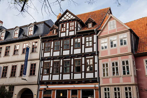 Old historical houses in Essen Werden. House in center of row houses has dormers. All are ha;f-timbered