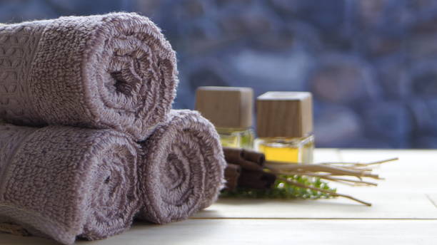istock Beautiful spa composition on massage table , spa relax concept, copy space, beautiful spa set on wood table 1455270288