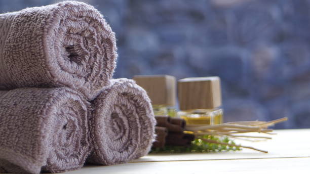 istock Beautiful spa composition on massage table , spa relax concept, copy space, beautiful spa set on wood table 1455270289