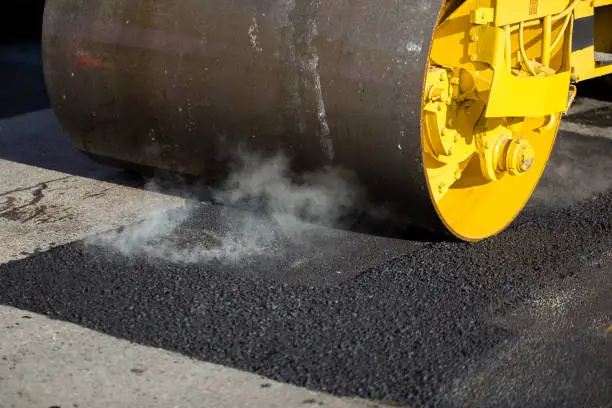 Photo of Road roller compacting asphalt