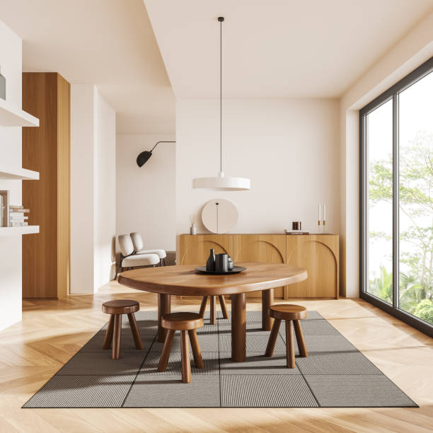 istock Light living room interior with dining table and drawer, panoramic window 1455273369