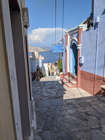 A narrow street in the town of Symi on the island of the same name looking towards the Aegean sea