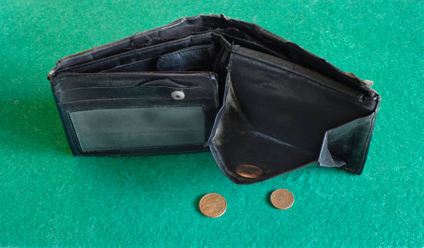 empty wallet and coins, financial crisis, inflation,danger of poverty concept. stock photo