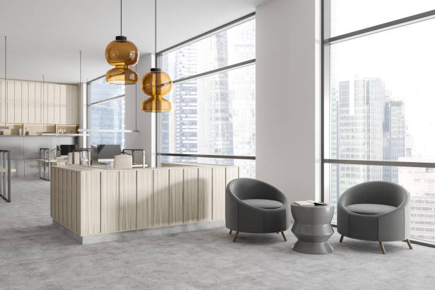 istock Corner view on bright office room interior with two armchairs 1455276059