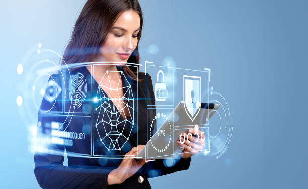 istock Businesswoman using tablet, face recognition hologram and data security 1455277274
