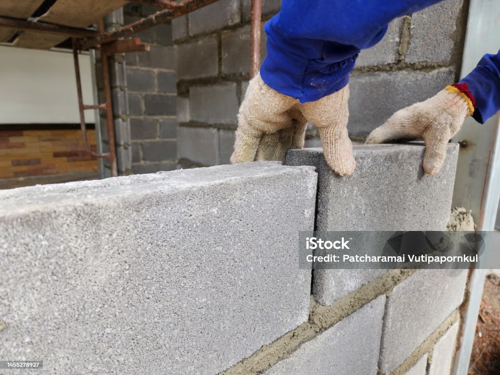 Construction work by putting bricks together and plastering the walls requires expertise Construction work by putting bricks together and plastering the walls requires expertise and experience of technicians. Boundary Stock Photo