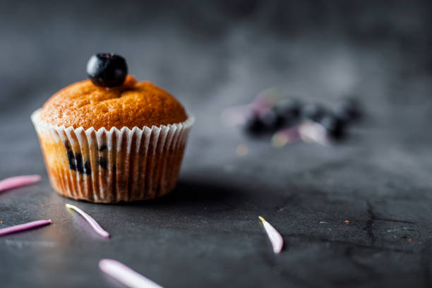 Tasty homemade cupcakes on dining table for dinner party.