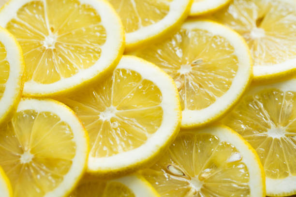 istock A slices of fresh yellow lemon texture background pattern 1455282597