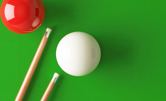 Snooker cue and pool balls ball over pool table. Directly above. Horizontal composition with copy space. Snooker concept.