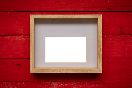 Christmas decorations and red ornaments. Wooden frame mockup