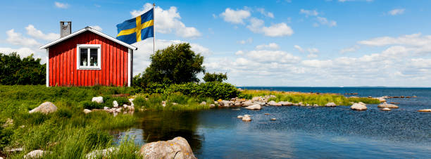Red house in Sweden with flag stock photo