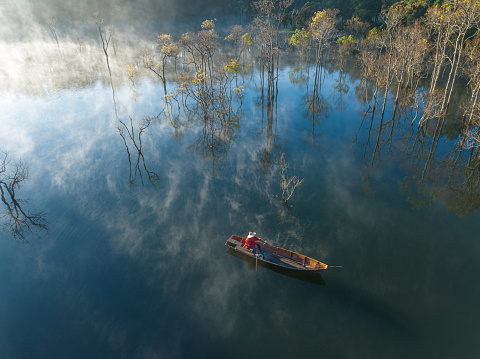 Fisherman in Ru Cha forest - a mangrove forest in leaf changing season - Huong Phong, Huong Tra, Thua Thien Hue province