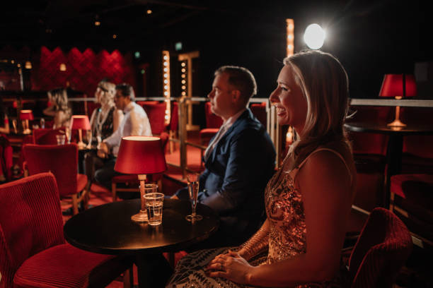 adult women perform a play in a theater