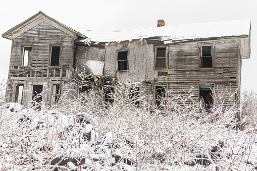 Decaying old house in winter