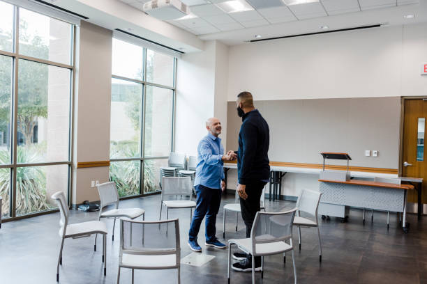 istock Mature man greets friend 1455291108