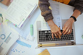 accountant woman with documents and laptop working