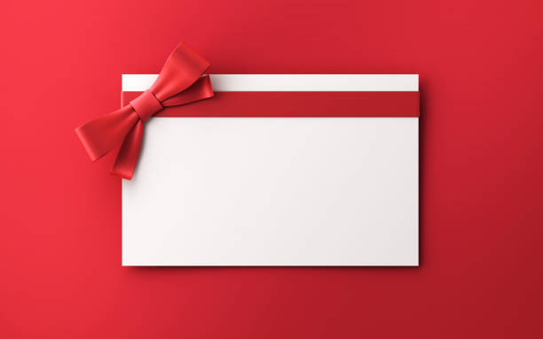 Gift Cards With Red Colored Bow on red background stock photo