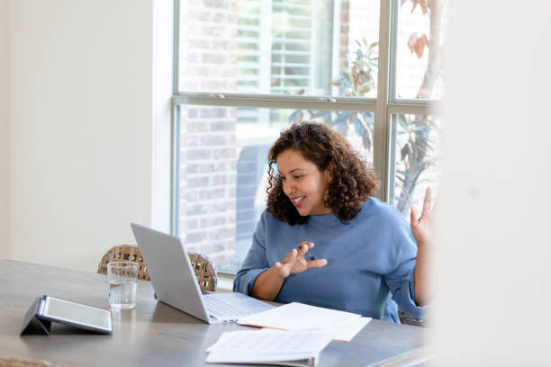 istock Mature financial consultant works with client from home 1455291851