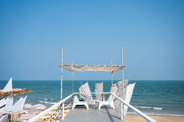 Beach restaurant shacks and sunbeds on Arambol beach in north Goa, India